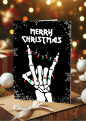 Christmas card with skeleton hands holding lights against a festive background
