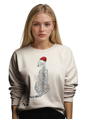 Woman wearing a beige sweater with a cheetah graphic and Santa hat on a white background