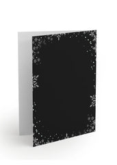 Black greeting card with white snowflake pattern on a white background