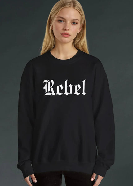 Person wearing a black sweatshirt with 'Rebel' printed on it against a dark background